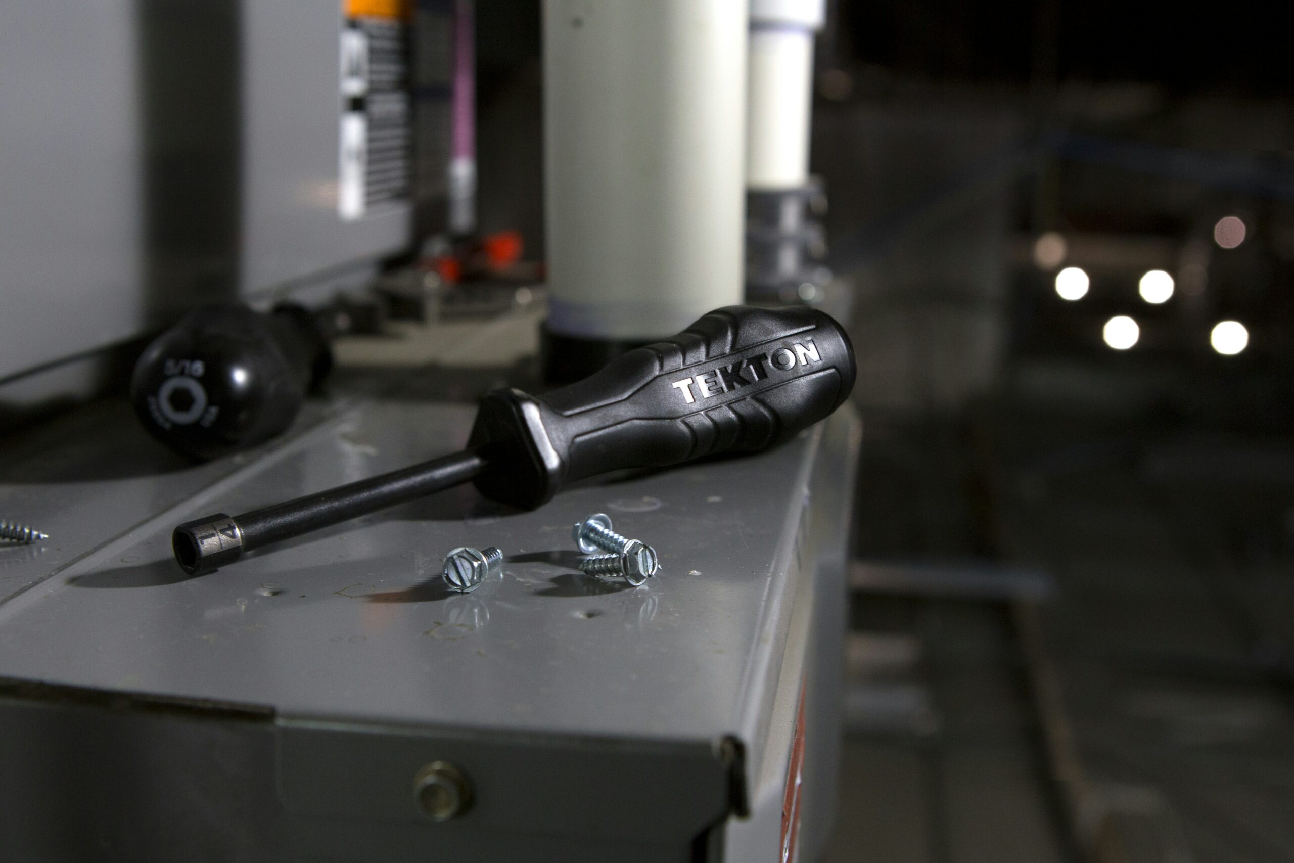 A screwdriver on top of a furnace for maintenance